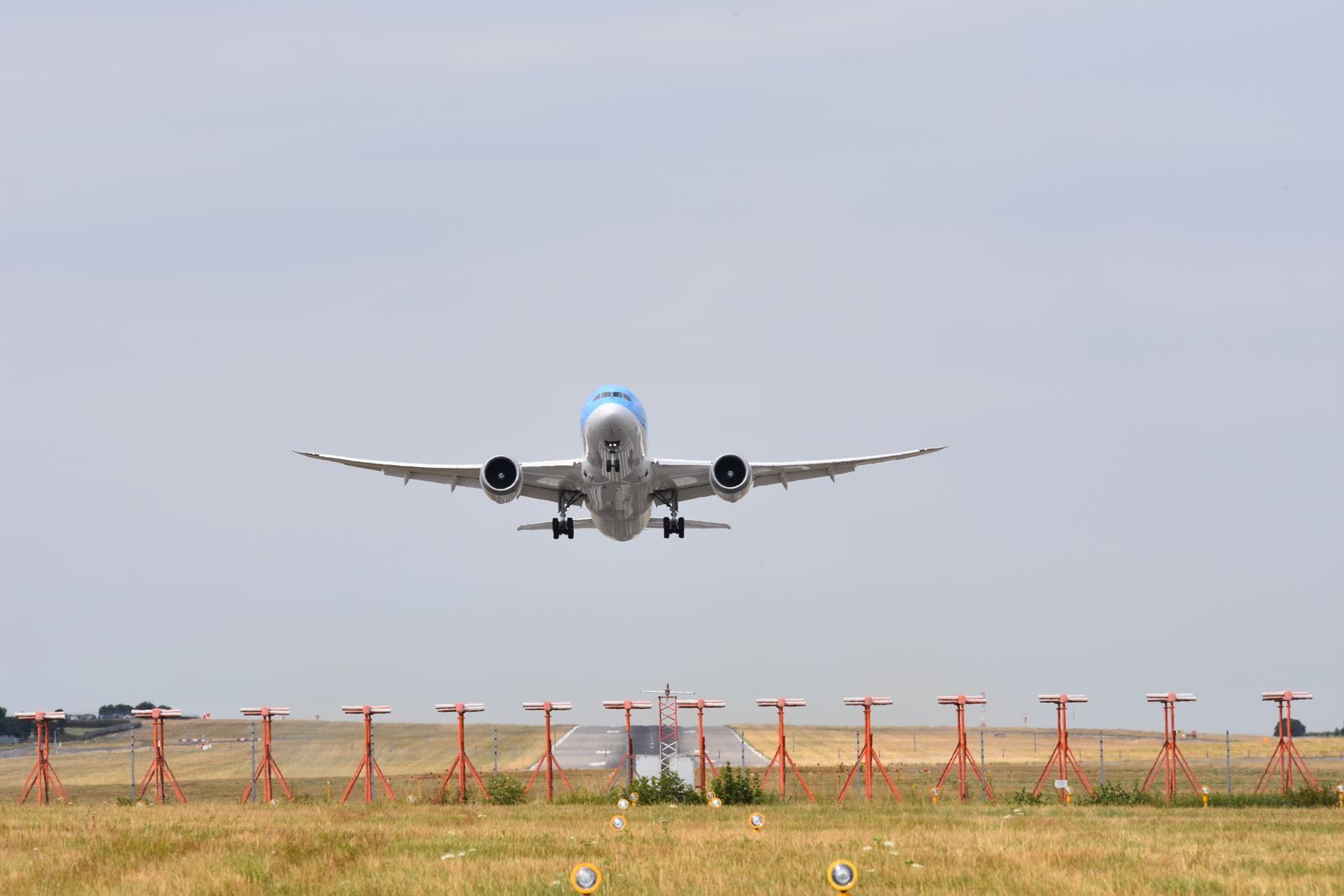 Wide-body passenger jet taking off from a runway